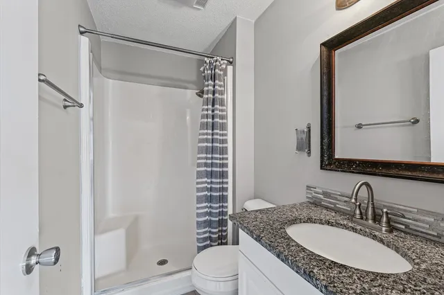 a view of a ceiling fan with wooden floor