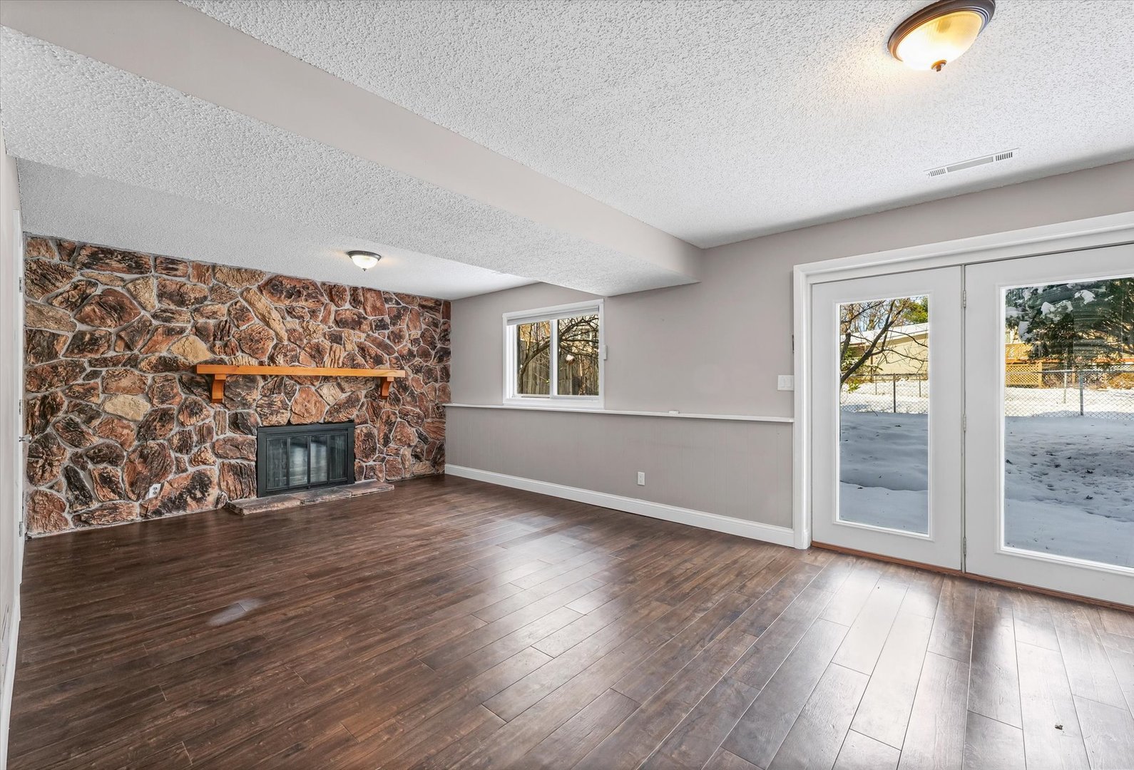 702 Devonshire Drive Champaign, IL 61820 - Photo 22 of 37 an empty room with wooden floor and windows