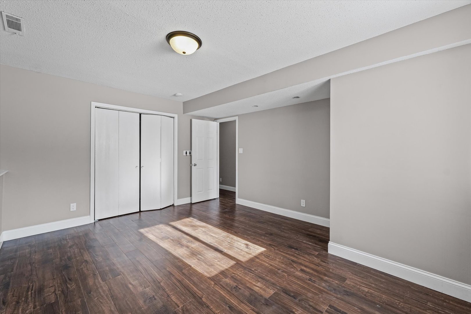 702 Devonshire Drive Champaign, IL 61820 - Photo 29 of 37 a view of an empty room with wooden floor