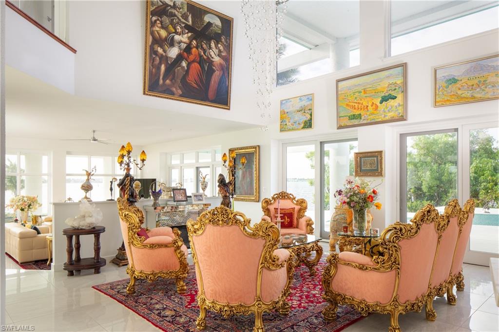 14040 Schultz Road Fort Myers, FL 33908 - Photo 21 of 48 Tiled living room with a towering ceiling and ceiling fan