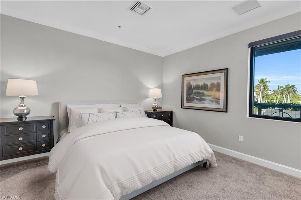 428 9th Street South Naples, FL 34102 - Photo 14 of 24 a bedroom with bed and wall painting