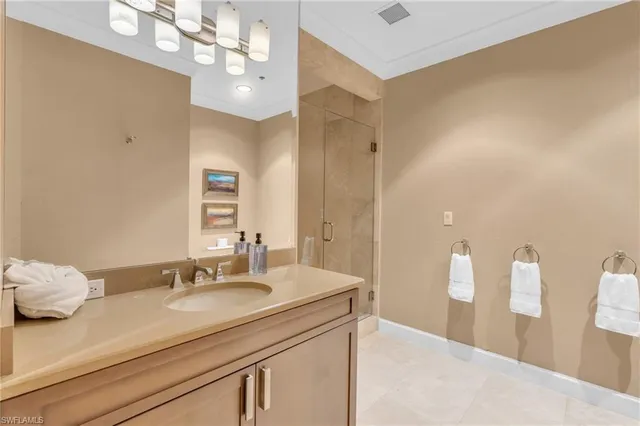 a bathroom with a sink a vanity and a mirror