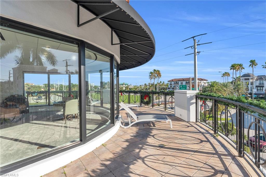 428 9th Street South Naples, FL 34102 - Photo 16 of 24 a view of a balcony with couch