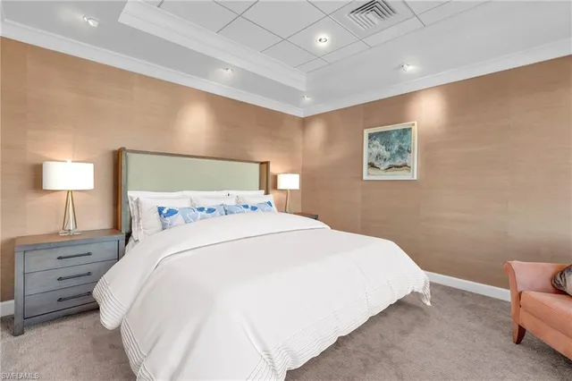 a bedroom with a bed and a night stand