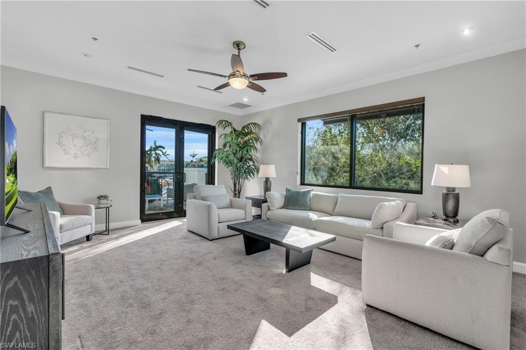 428 9th Street South Naples, FL 34102 - Photo 2 of 24 a living room with furniture and a large window