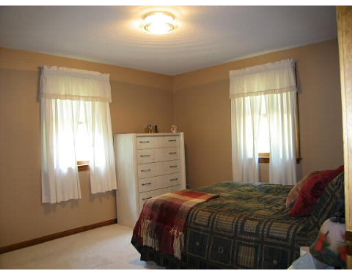 133 Munn Road Monson, MA 01057 - Photo 5 of 9 a bedroom with a bed and a window