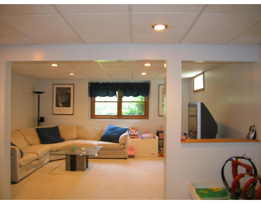 133 Munn Road Monson, MA 01057 - Photo 8 of 9 a living room with furniture a window and a flat screen tv