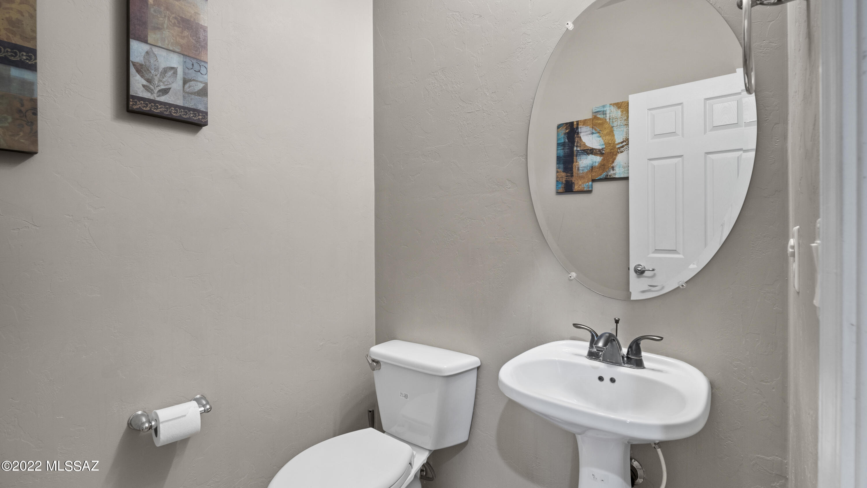 1081 Vista De Los Alamos Rio Rico, AZ 85648 - Photo 31 of 45 a bathroom with a sink mirror and toilet