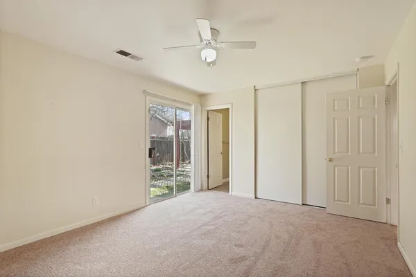 a view of an empty room with a window