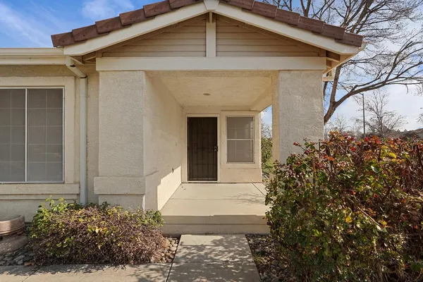 a front view of a house with garden