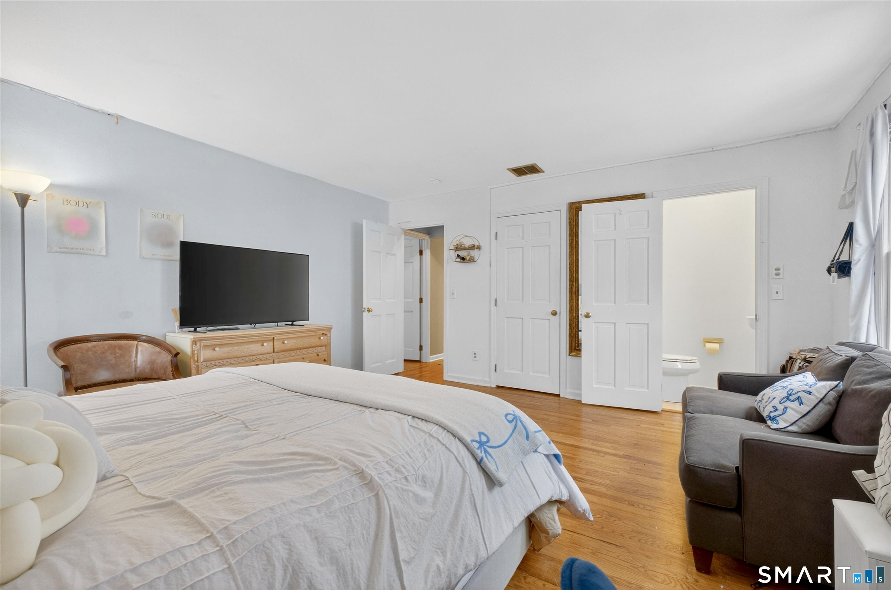 123 A Peaceable Street Redding, CT 06896 - Photo 32 of 44 a bedroom with bed and glass window