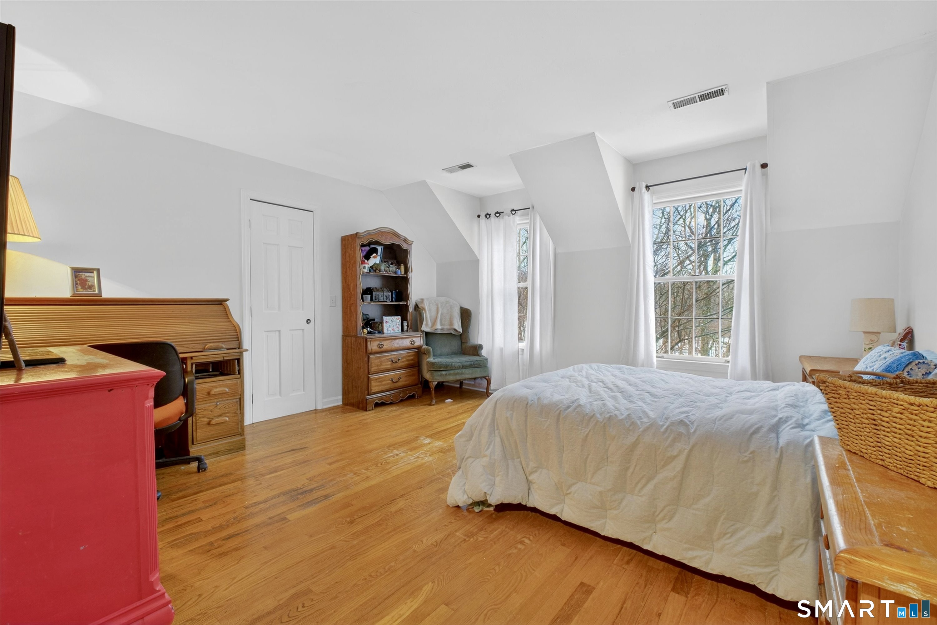 123 A Peaceable Street Redding, CT 06896 - Photo 35 of 44 a bedroom with a bed and wooden floor