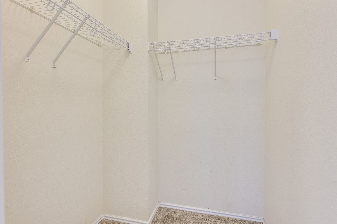 356 Wetzel Kyle, TX 78640 - Photo 12 of 24 a view of a room with racks on the wall