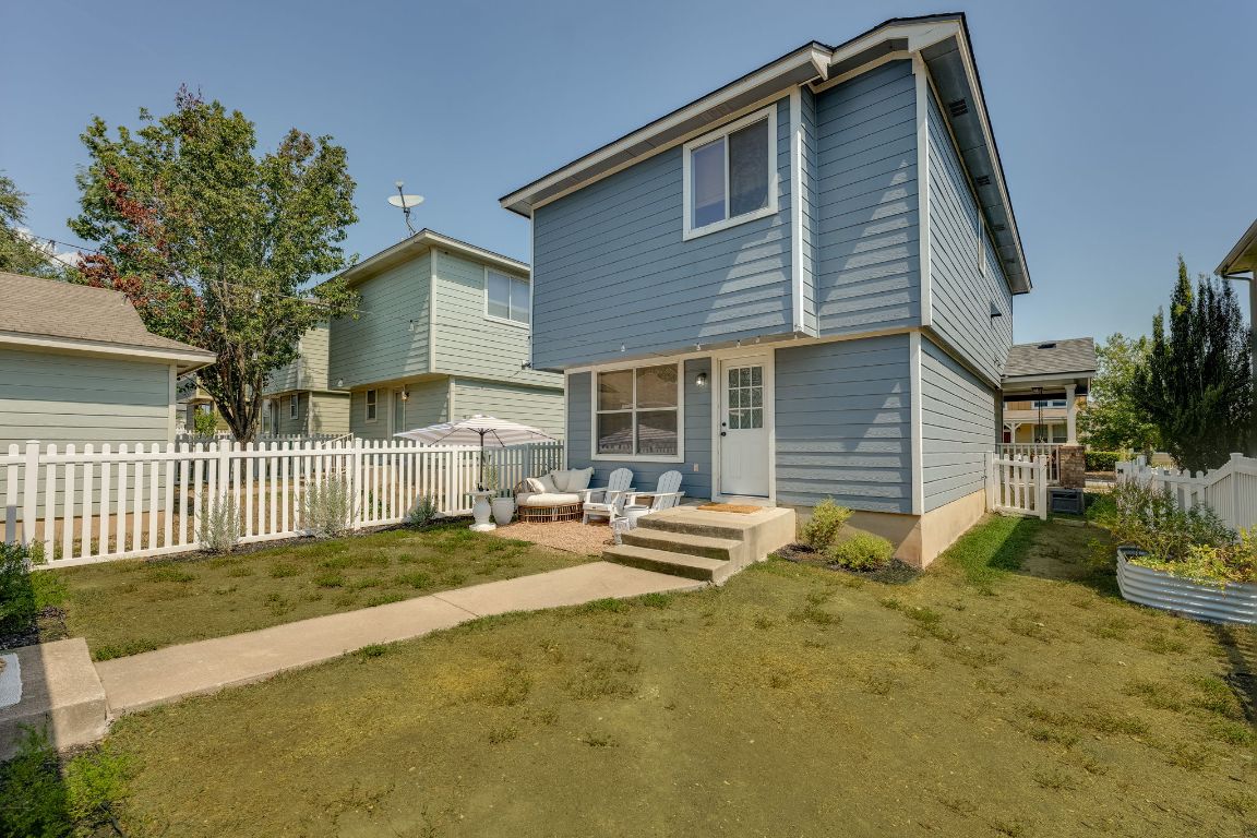356 Wetzel Kyle, TX 78640 - Photo 19 of 24 a front view of a house with a garden and patio