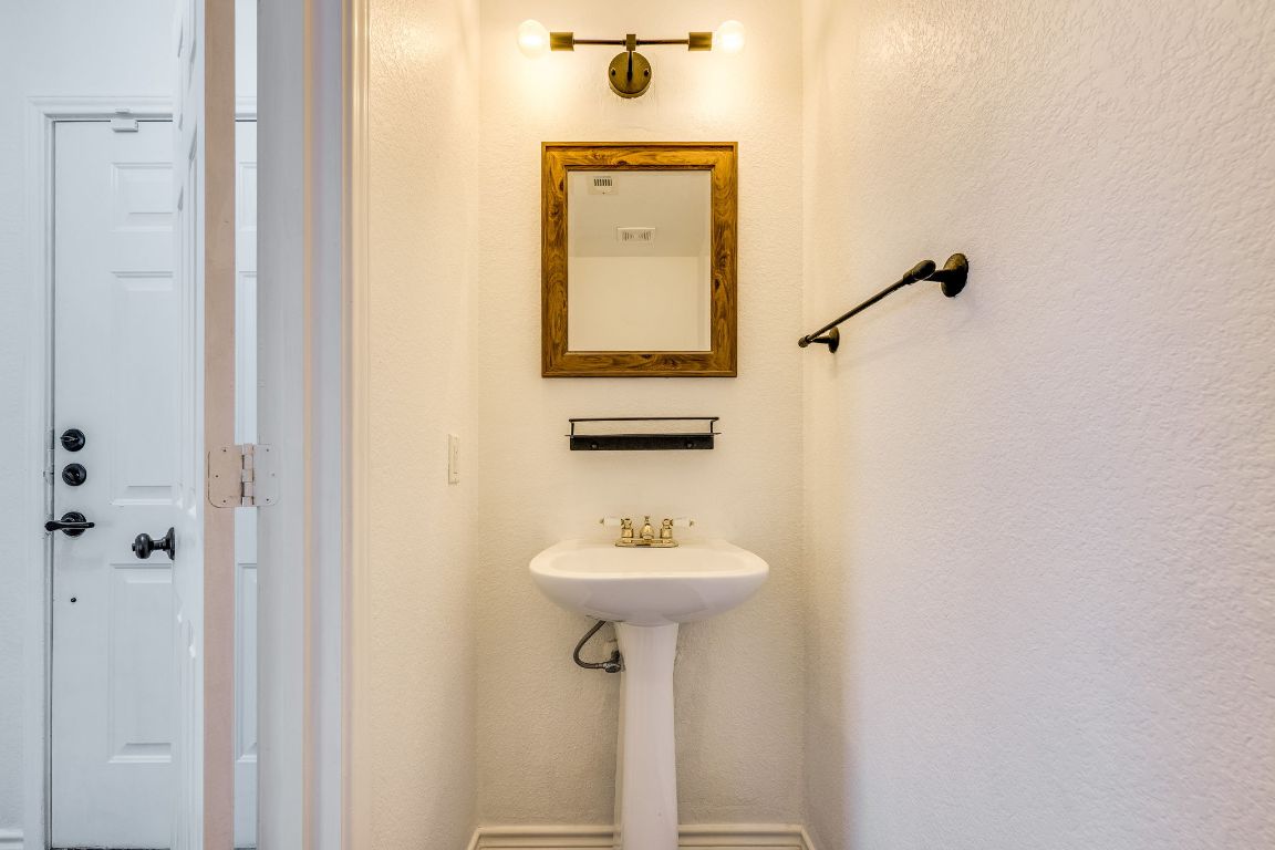 356 Wetzel Kyle, TX 78640 - Photo 9 of 24 a bathroom with a sink and a mirror