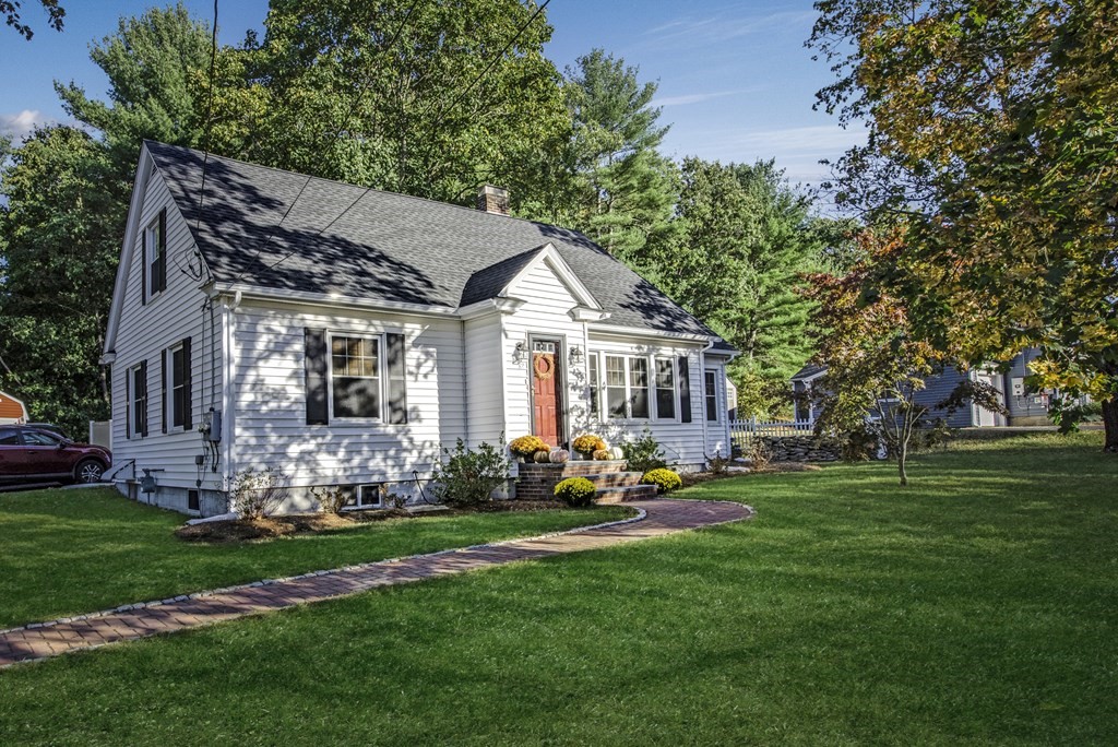 32 Concord Road Chelmsford, MA 01824 - Photo 1 of 27 a front view of a house with garden and trees
