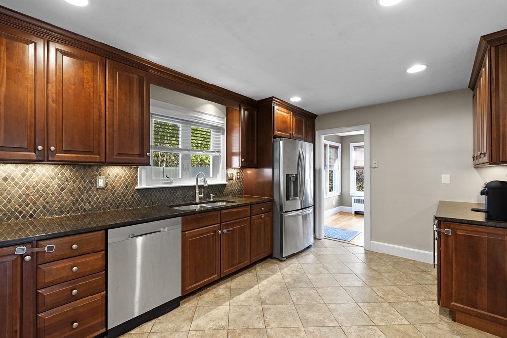 32 Concord Road Chelmsford, MA 01824 - Photo 12 of 27 a kitchen with granite countertop a sink stainless steel appliances and cabinets