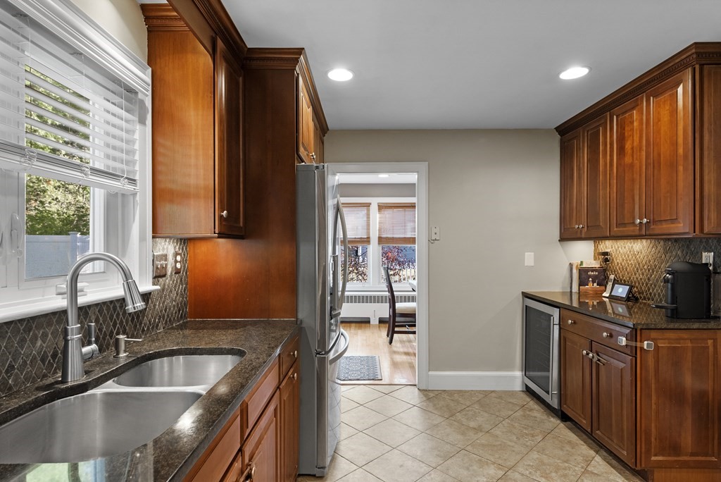 32 Concord Road Chelmsford, MA 01824 - Photo 13 of 27 a kitchen with granite countertop a sink and cabinets