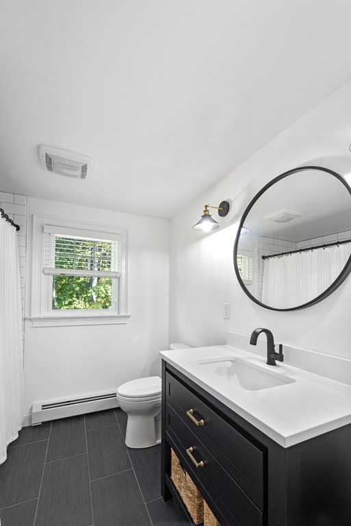 32 Concord Road Chelmsford, MA 01824 - Photo 24 of 27 a bathroom with a sink mirror and toilet