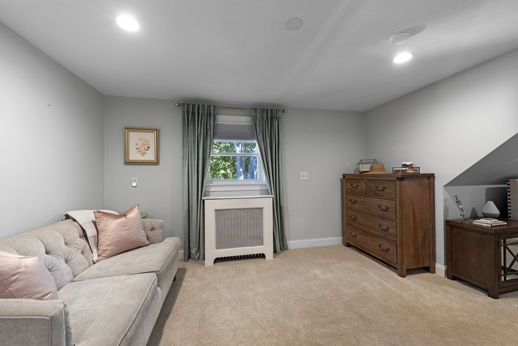 32 Concord Road Chelmsford, MA 01824 - Photo 25 of 27 a living room with furniture and a closet