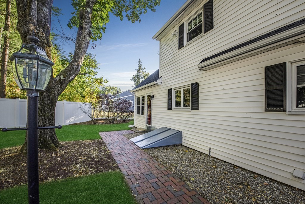 32 Concord Road Chelmsford, MA 01824 - Photo 5 of 27 a front view of a house with garden