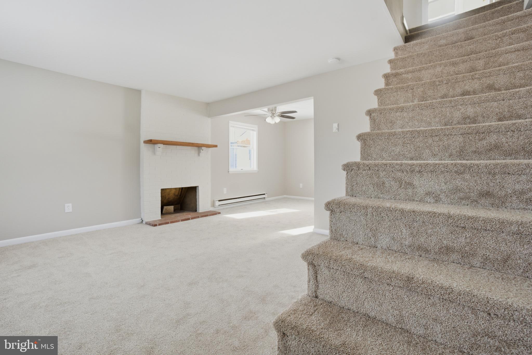 5605 Shelbourne Road, Unit B Baltimore, MD 21227 - Photo 4 of 20 a view of staircase with white walls