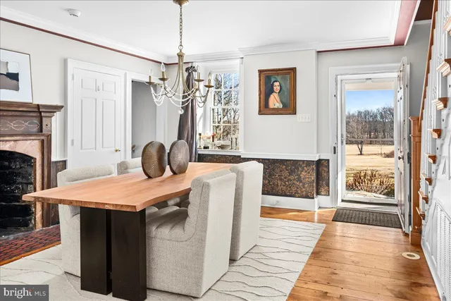 a dining room with a table and chairs