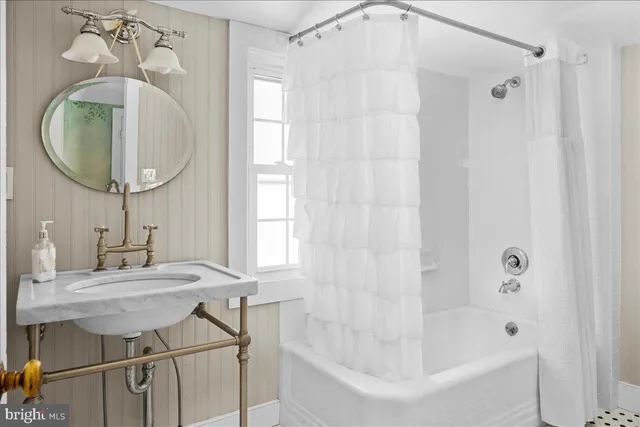 an entryway with a white walls