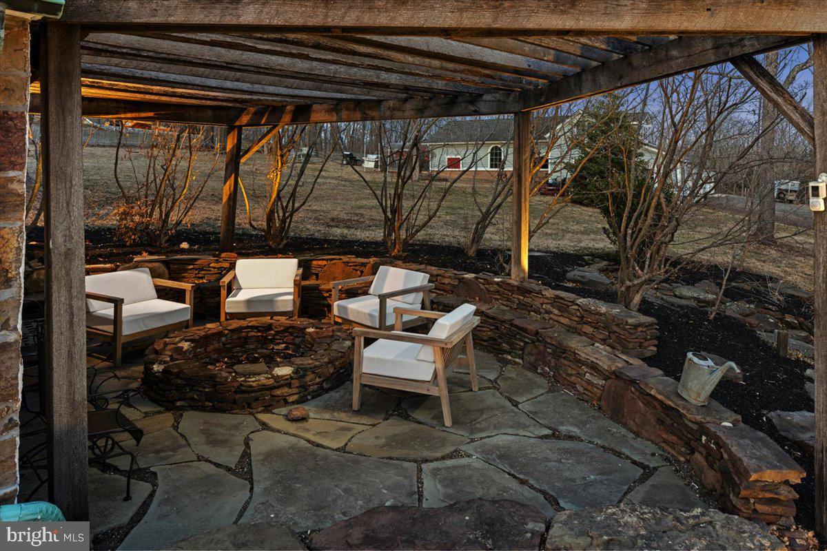 1515 Sugar Bottom Road Furlong, PA 18925 - Photo 6 of 52 a couple of blue chairs sitting in a backyard