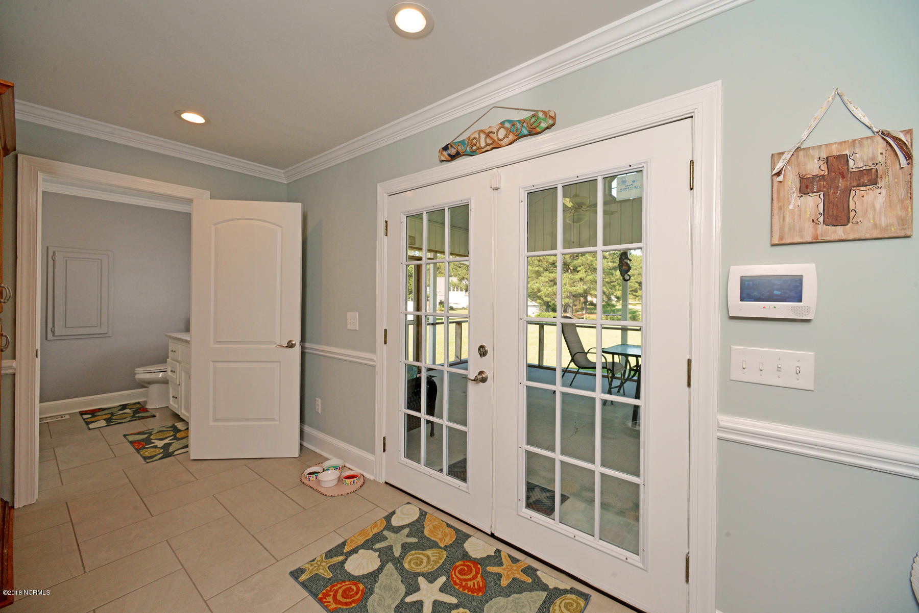 3907 Edwards Road Grimesland, NC 27837 - Photo 29 of 51 opens to screened porch