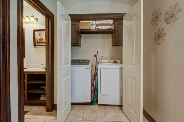 a utility room with closet dryer and washer