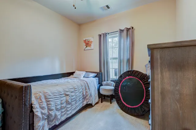 a bedroom with a bed and utility