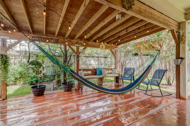 a view of a room with wooden floor and iron stairs