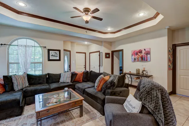 a living room with furniture and a large window