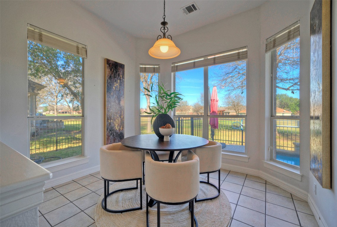 10833 Olympia Fields Loop Austin, TX 78747 - Photo 16 of 38 a dining room with furniture and window