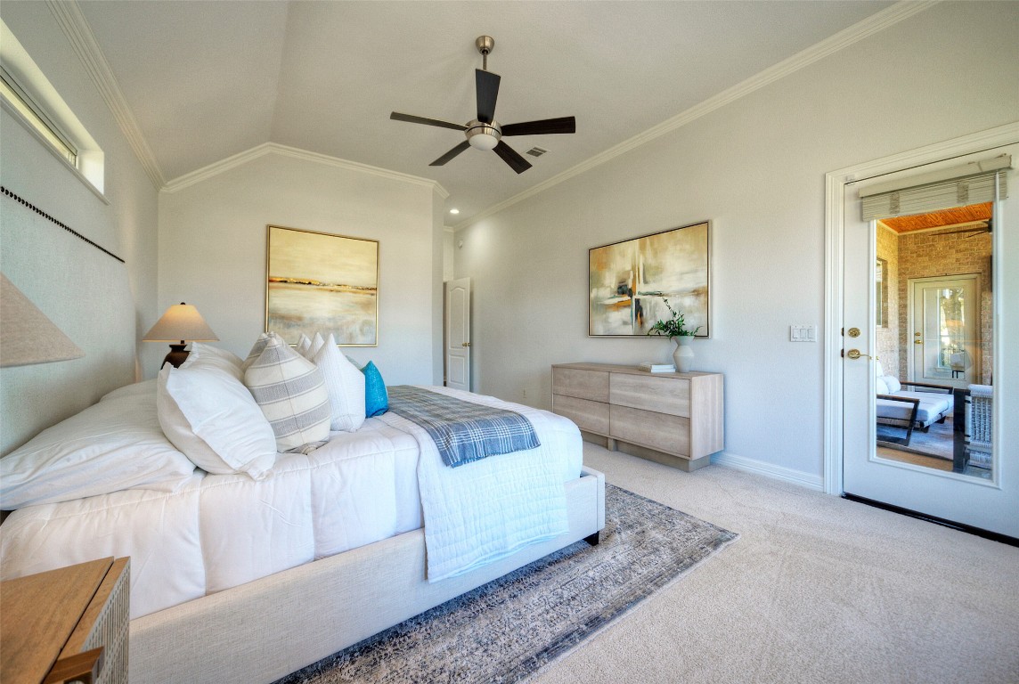 10833 Olympia Fields Loop Austin, TX 78747 - Photo 19 of 38 a bedroom with a bed and a large mirror