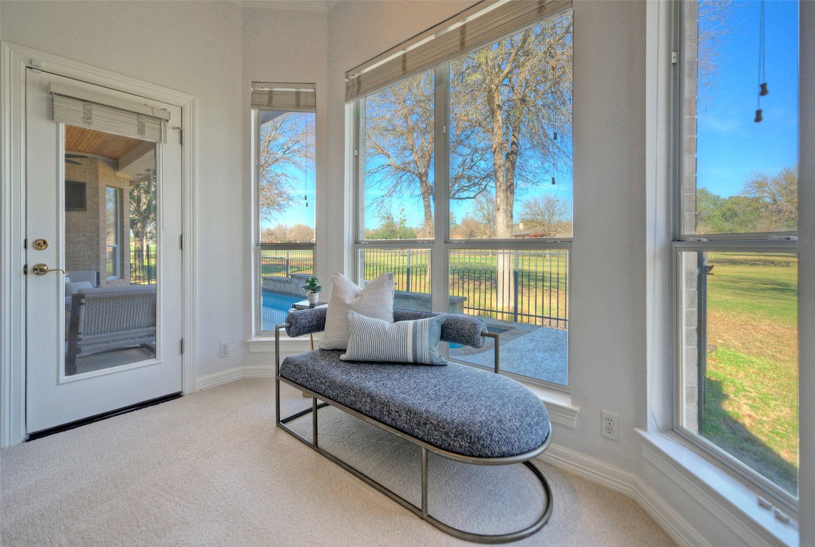 10833 Olympia Fields Loop Austin, TX 78747 - Photo 20 of 38 a living room with furniture and a large window