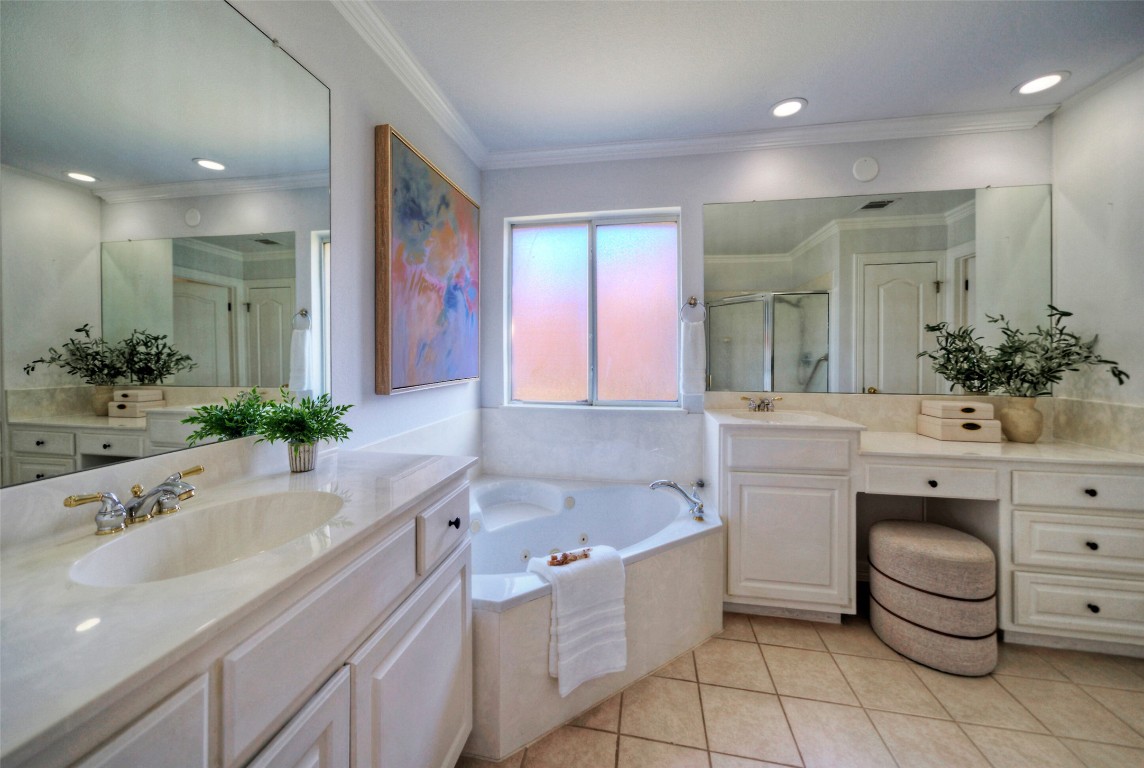 10833 Olympia Fields Loop Austin, TX 78747 - Photo 21 of 38 a bathroom with a bathtub sink and mirror