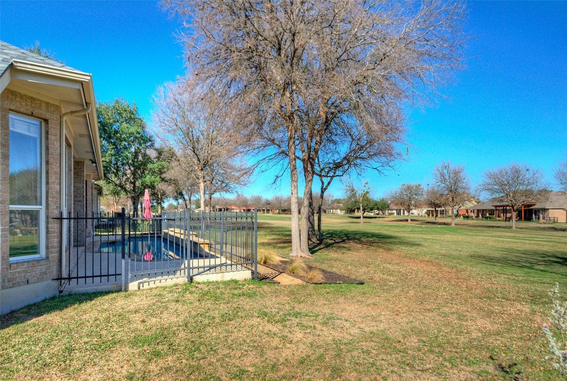 10833 Olympia Fields Loop Austin, TX 78747 - Photo 30 of 38 a view of a yard with a slide