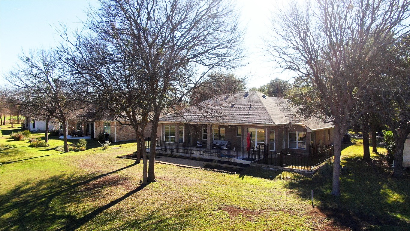 10833 Olympia Fields Loop Austin, TX 78747 - Photo 36 of 38 a view of a house with a yard covered in snow