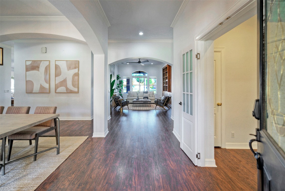 10833 Olympia Fields Loop Austin, TX 78747 - Photo 4 of 38 a view of a hallway with wooden floor windows and a livingroom