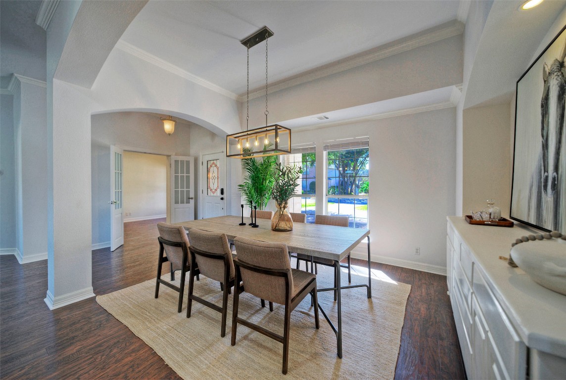 10833 Olympia Fields Loop Austin, TX 78747 - Photo 7 of 38 a view of a dining room with furniture window and wooden floor