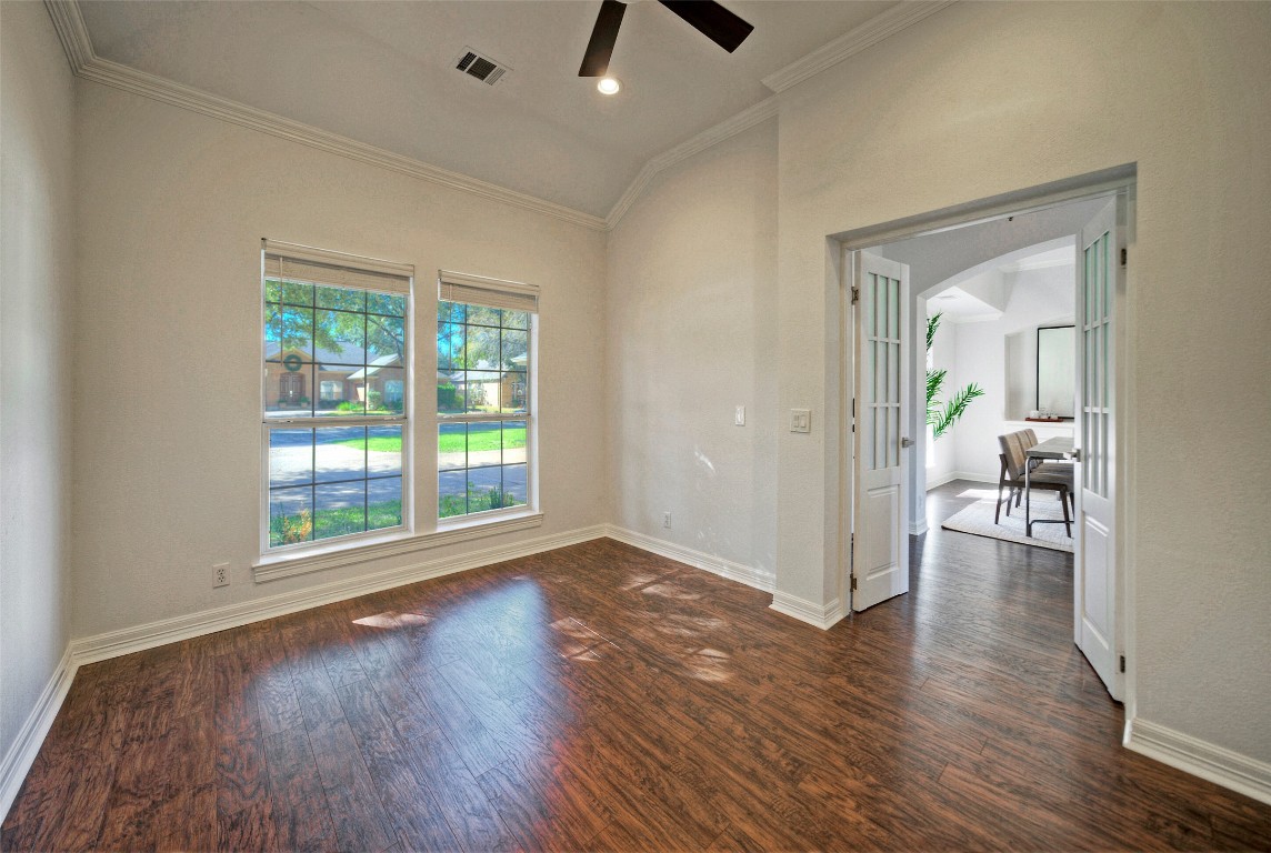 10833 Olympia Fields Loop Austin, TX 78747 - Photo 8 of 38 wooden floor in an empty room with a window
