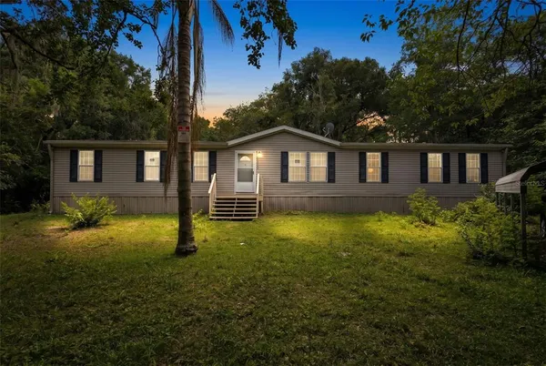 front view of a house with a yard