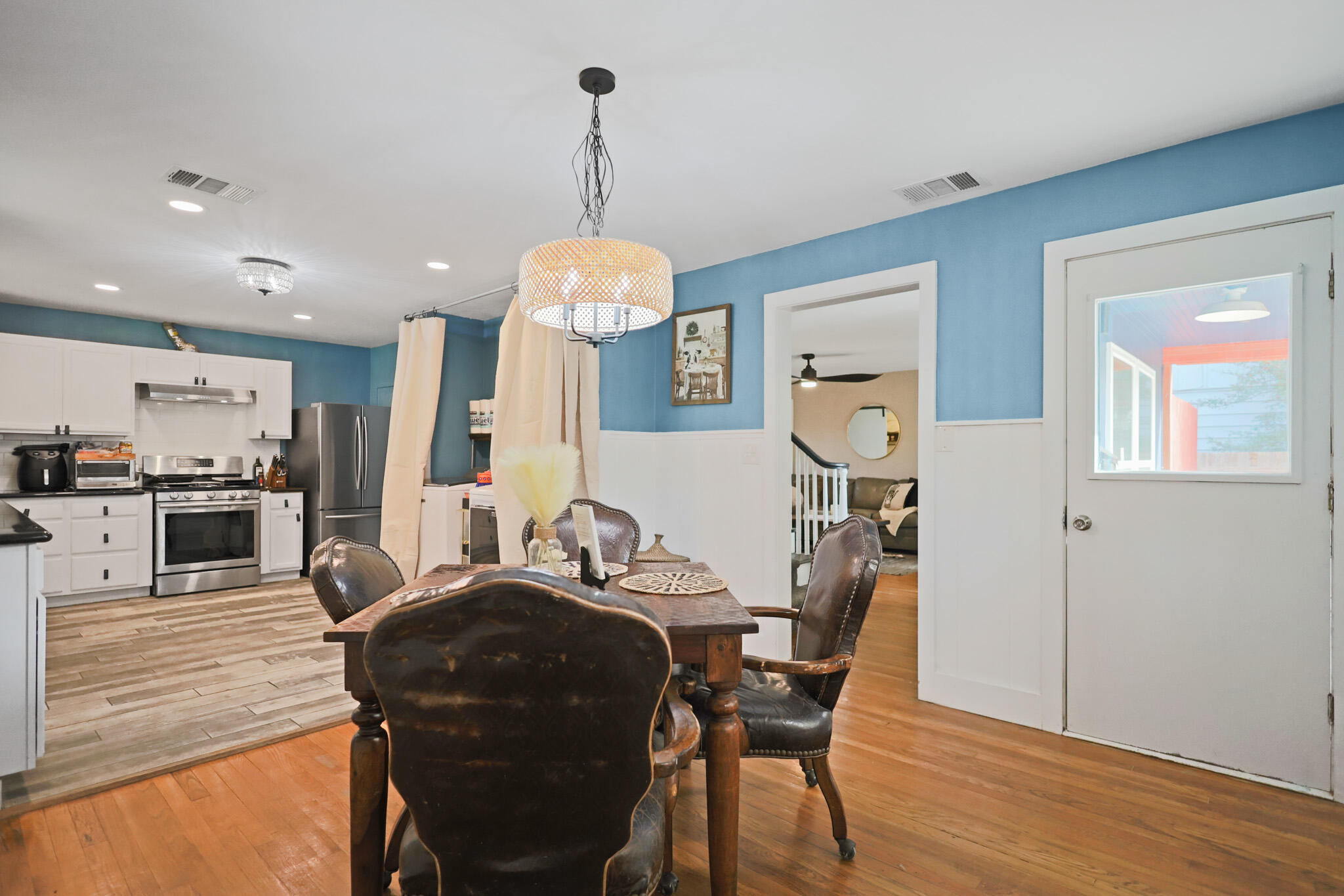 1904 28th Street Lubbock, TX 79411 - Photo 25 of 59 a view of a dining room with furniture wooden floor and chandelier