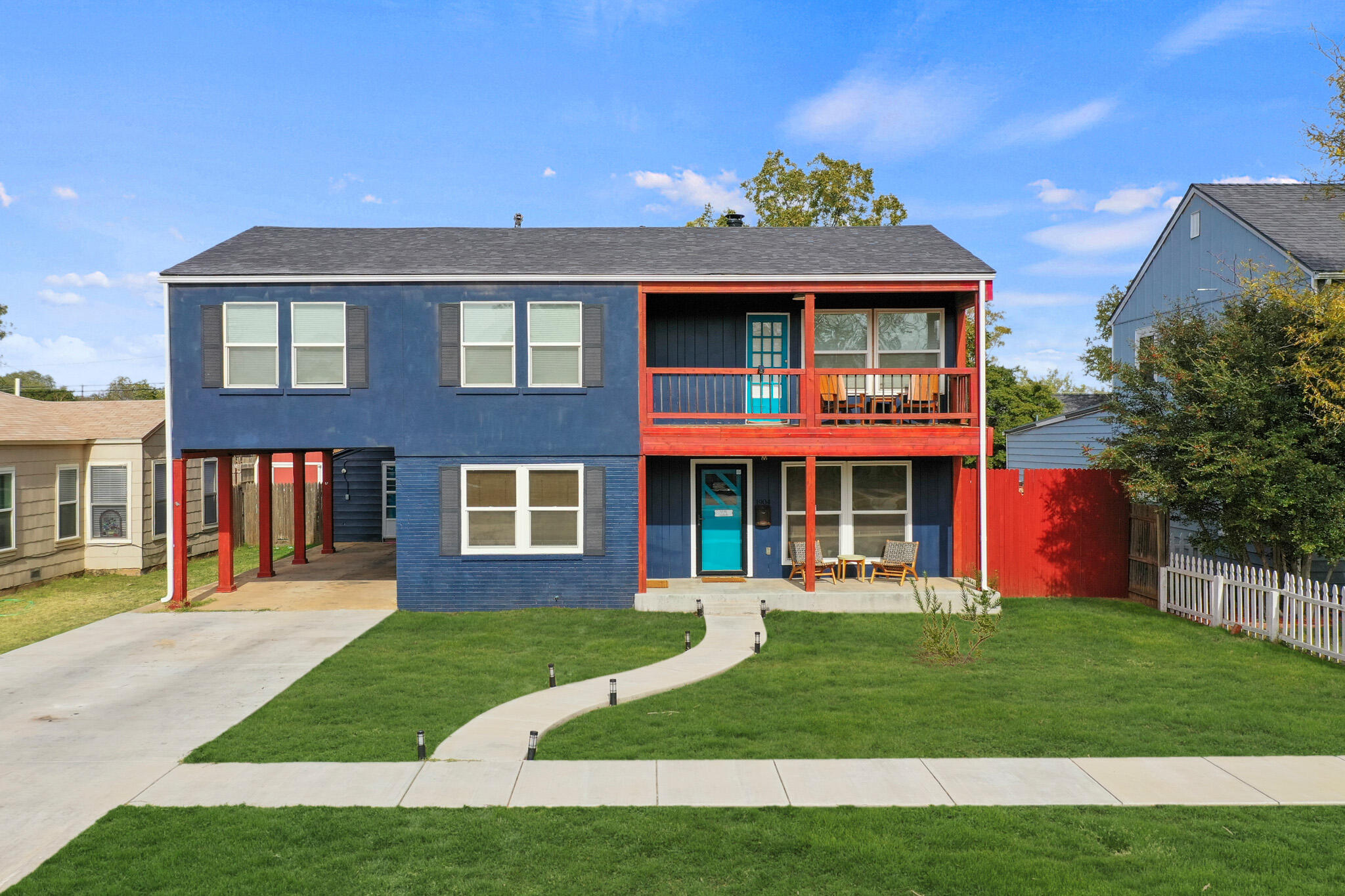 1904 28th Street Lubbock, TX 79411 - Photo 3 of 59 a front view of a house with a yard