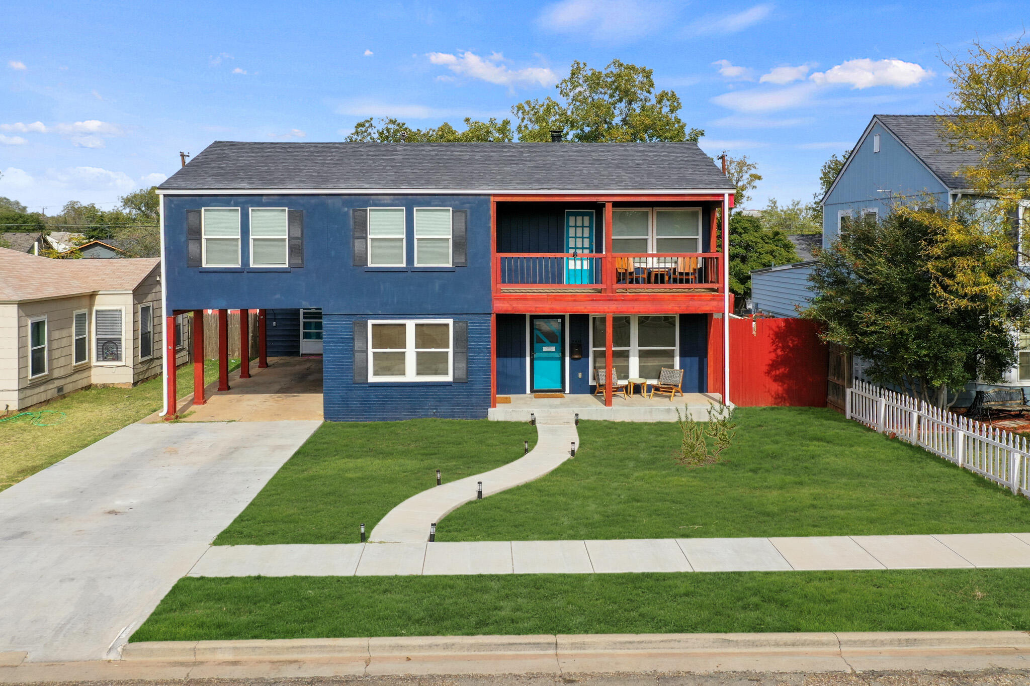 1904 28th Street Lubbock, TX 79411 - Photo 4 of 59 a front view of a house with garden