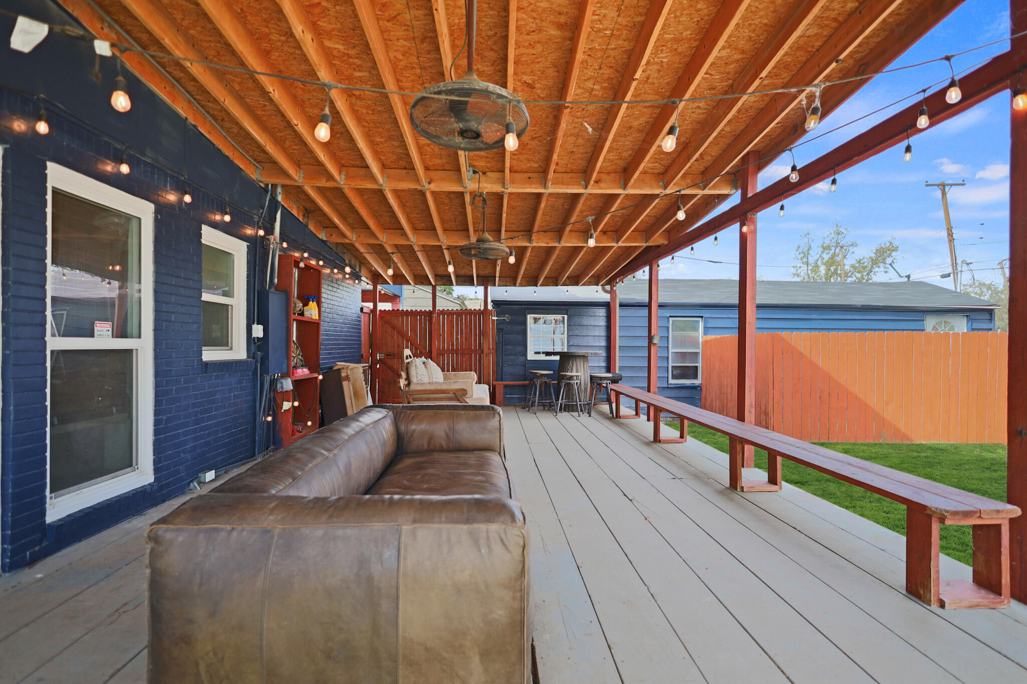 1904 28th Street Lubbock, TX 79411 - Photo 49 of 59 a view of a patio with a table chairs and wooden floor
