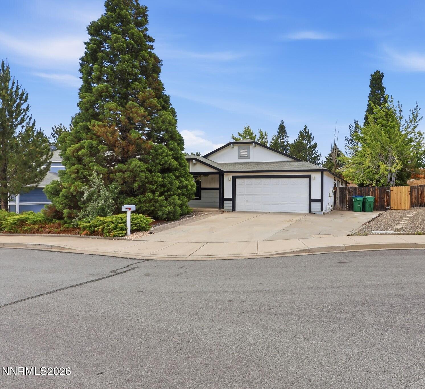 6840 Viscaya Court Reno, NV 89523 - Photo 1 of 25 a house with trees in the background