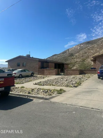 a view of a house with a snow on the road